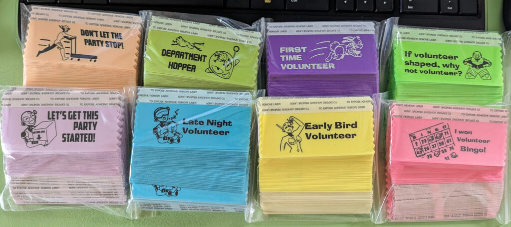 Many different volunteering-themed badge ribbons