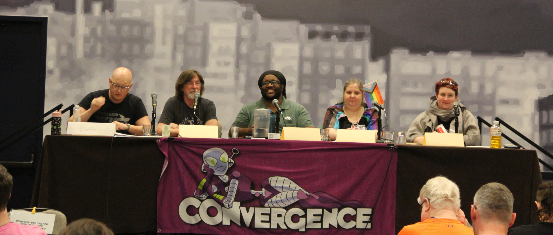 Panelists at CONvergence 2024 featuring fem-presenting people and masq-presenting people of multiple races